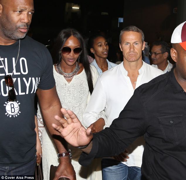 The party is over: Naomi Campbell and her boyfriend Vladimir Doronin return home after spending a lavish two days in Jodhpur celebrating his 50th birthday